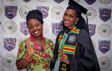 Caption: Naa Dedei Botchwey and Sophai Selasi Quashigah (in academic gown), one of the student beneficiaries Image provided